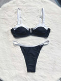 Black women's low waist bikini swimsuit with split sides and stitching detail