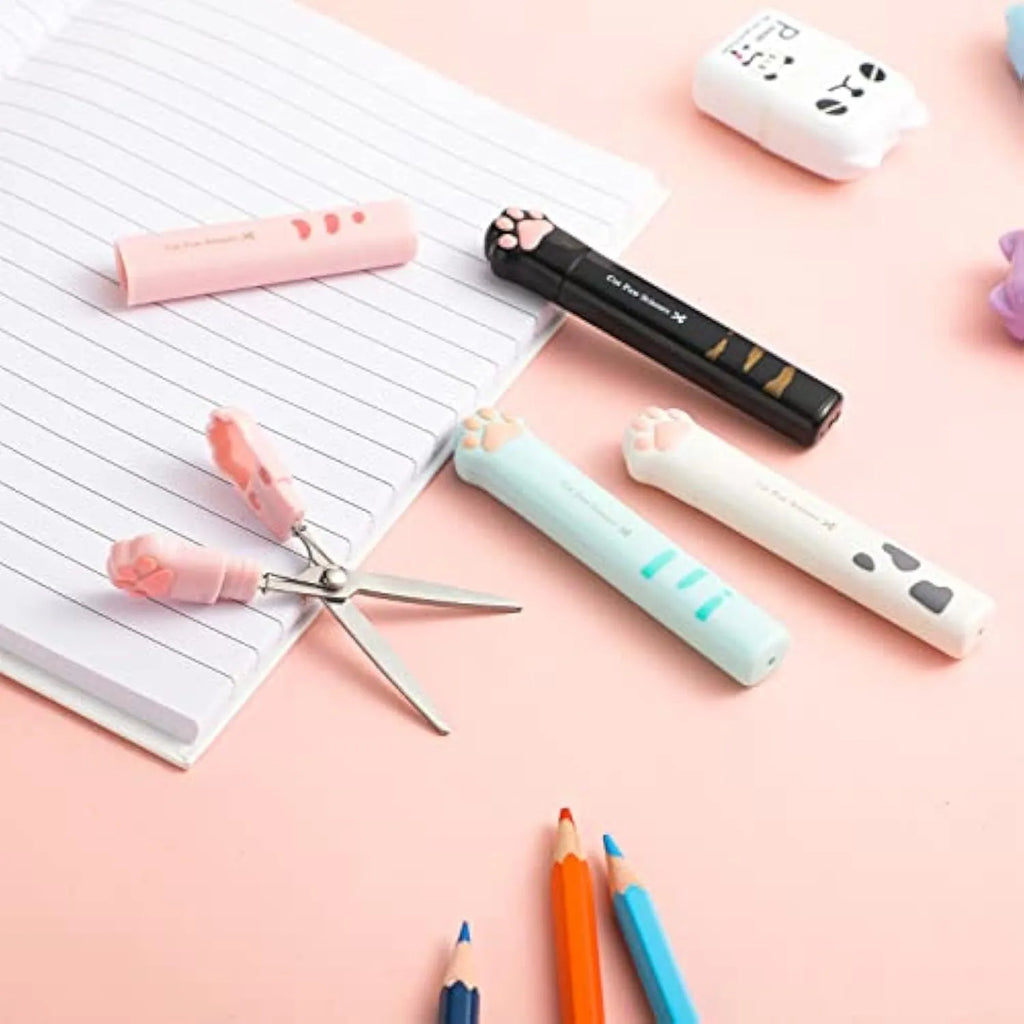 Set of four mini folding scissors with cat paw design in black, blue, pink, and white colours.