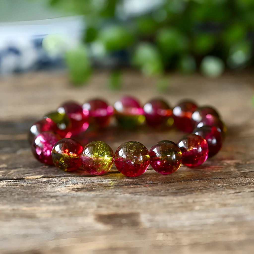 Handmade watermelon-coloured crystal bracelet for women shown in casual style.
