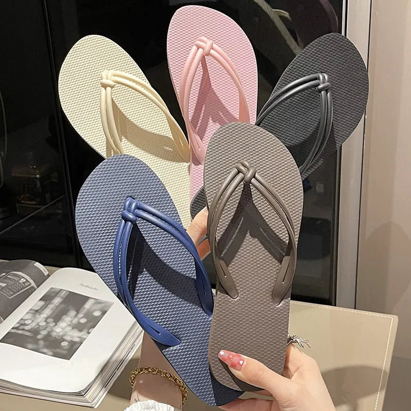 Women's pink flip flops with toe-covering design and non-slip PVC sole for summer outdoor wear