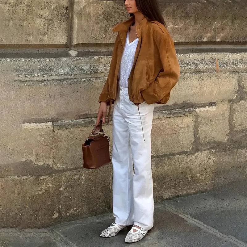 Retro loose fit solid colour polyester jacket with long sleeves on a model.