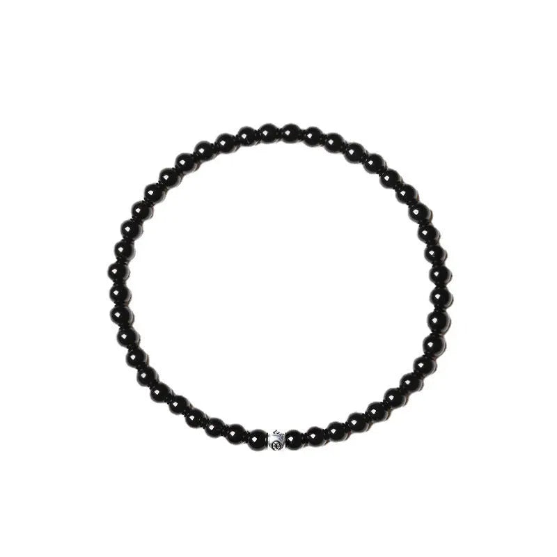 Unisex fine Obsidian Agate Blue San bracelet with electroplated finish and cut surface beads.