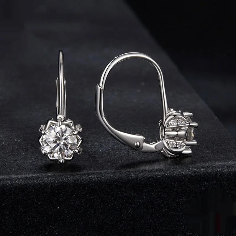 White gold plated sterling silver flower bud clip earrings with a moissanite centre stone