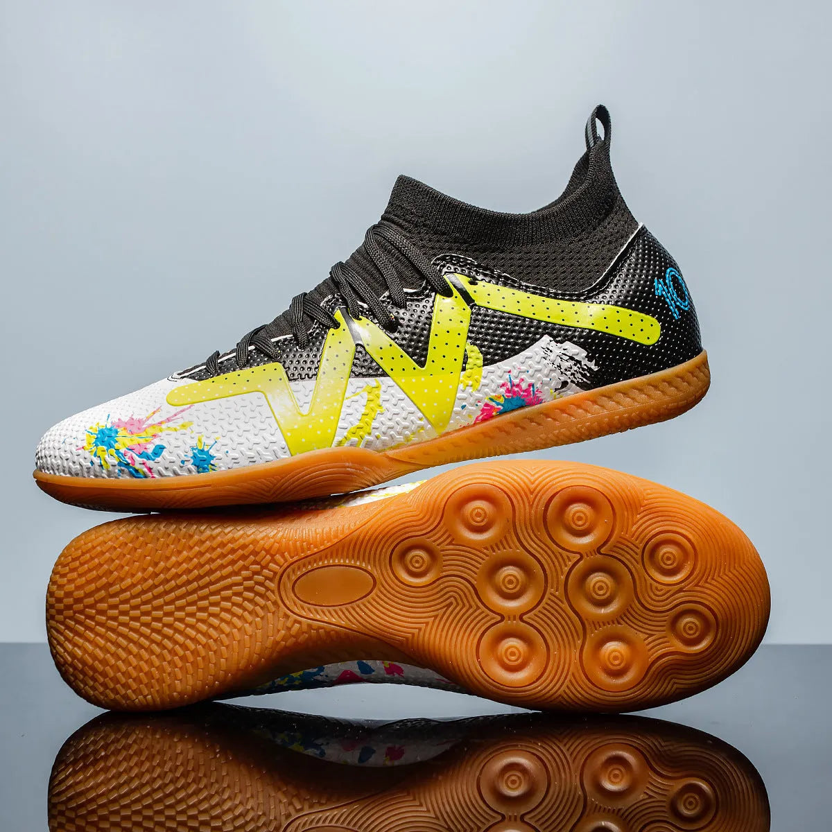 Adult football boots with non-slip rubber outsoles in black and yellow colourway