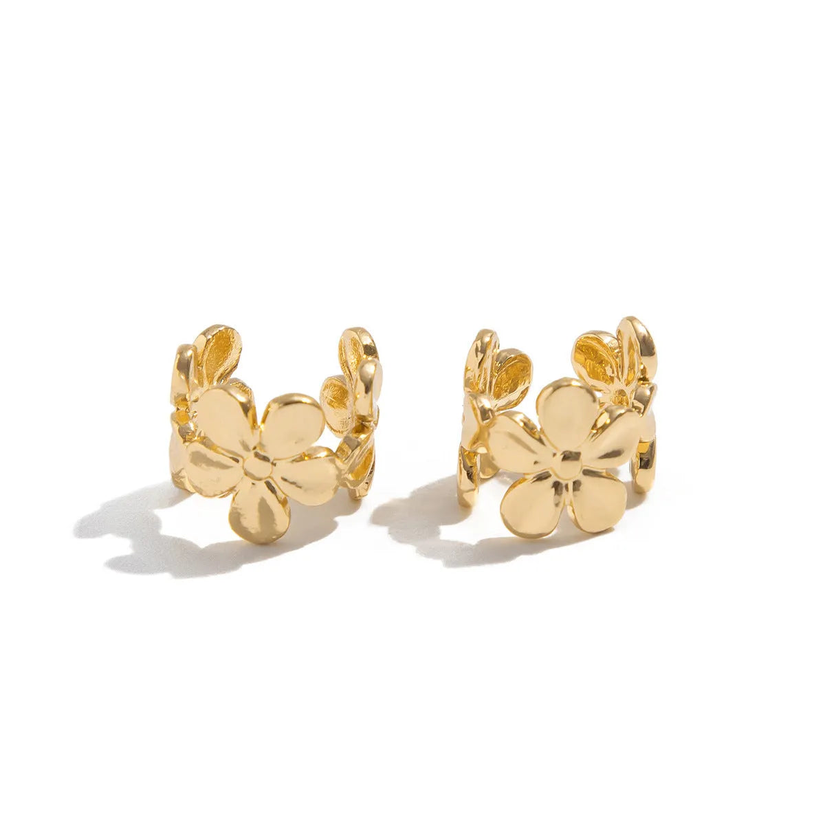 Gold tone women's earrings with starfish and conch shell design