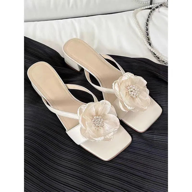 Women's fashion sandals with a chunky heel, square toe, and one-strap satin upper in cream-white colour.