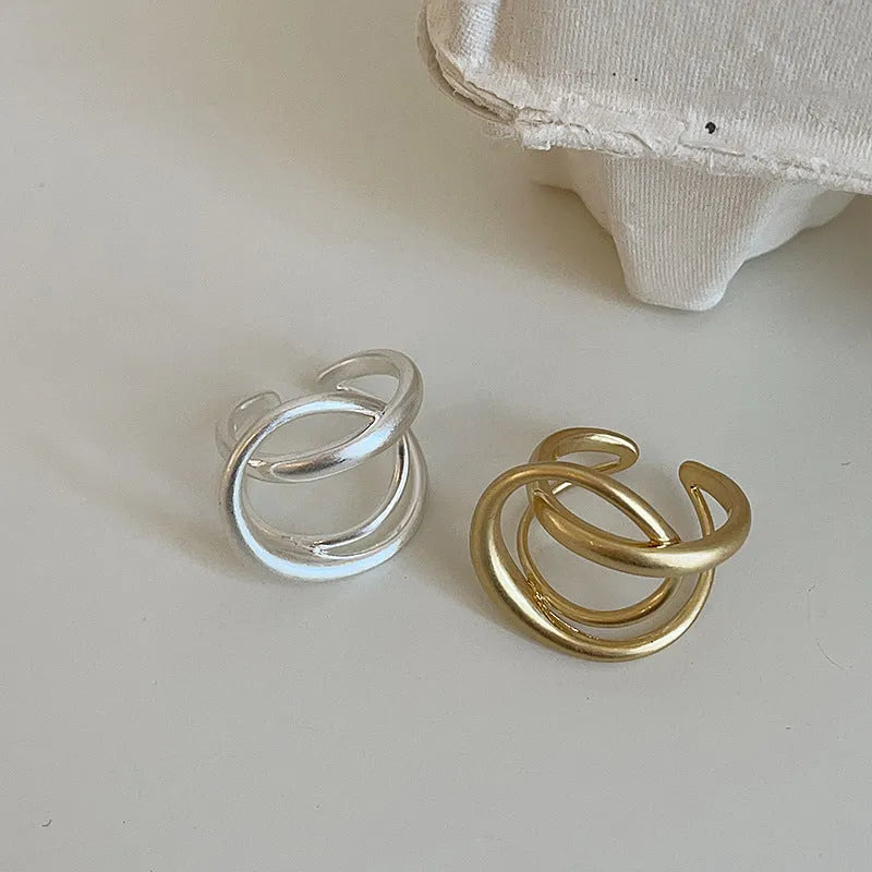Three-dimensional interlaced geometric open ring in matte metal with gold or silver plating