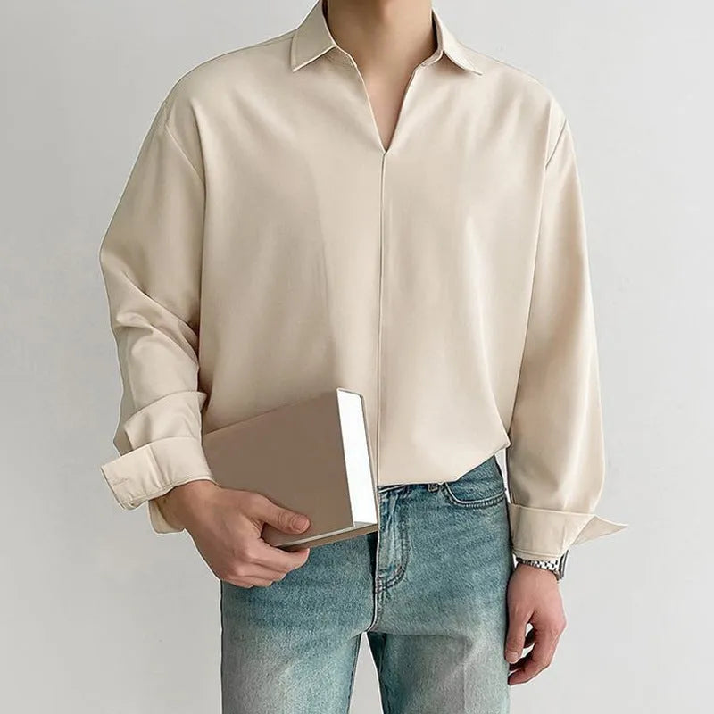 Men's loose fit long sleeve casual shirt in solid colour on a hanger.