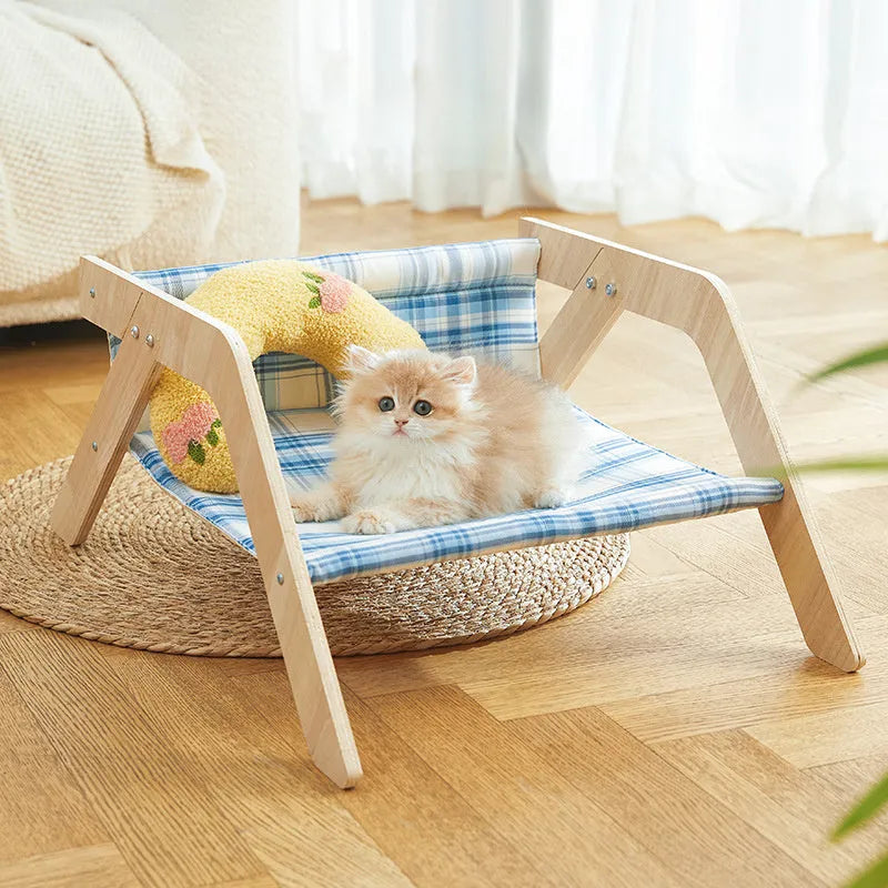 Wooden elevated cat bed with cloth hammock in beach chair design for indoor use