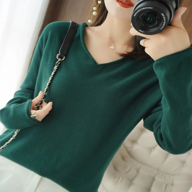 Women's V-neck long sleeve knitwear top in wine red colour, laid flat.