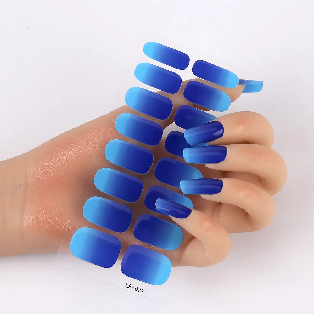 Full coverage nail art stickers sheet with 16 designs including cross, rose, tulip, and cartoon patterns.