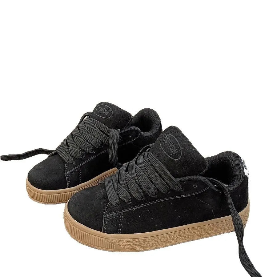 Black retro low-top sneakers with round toe design and waterproof platform construction