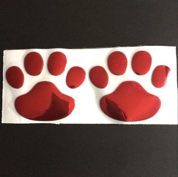 PVC dog footprint car sticker in black, gold, red, and silver colour options, measuring 7cm.
