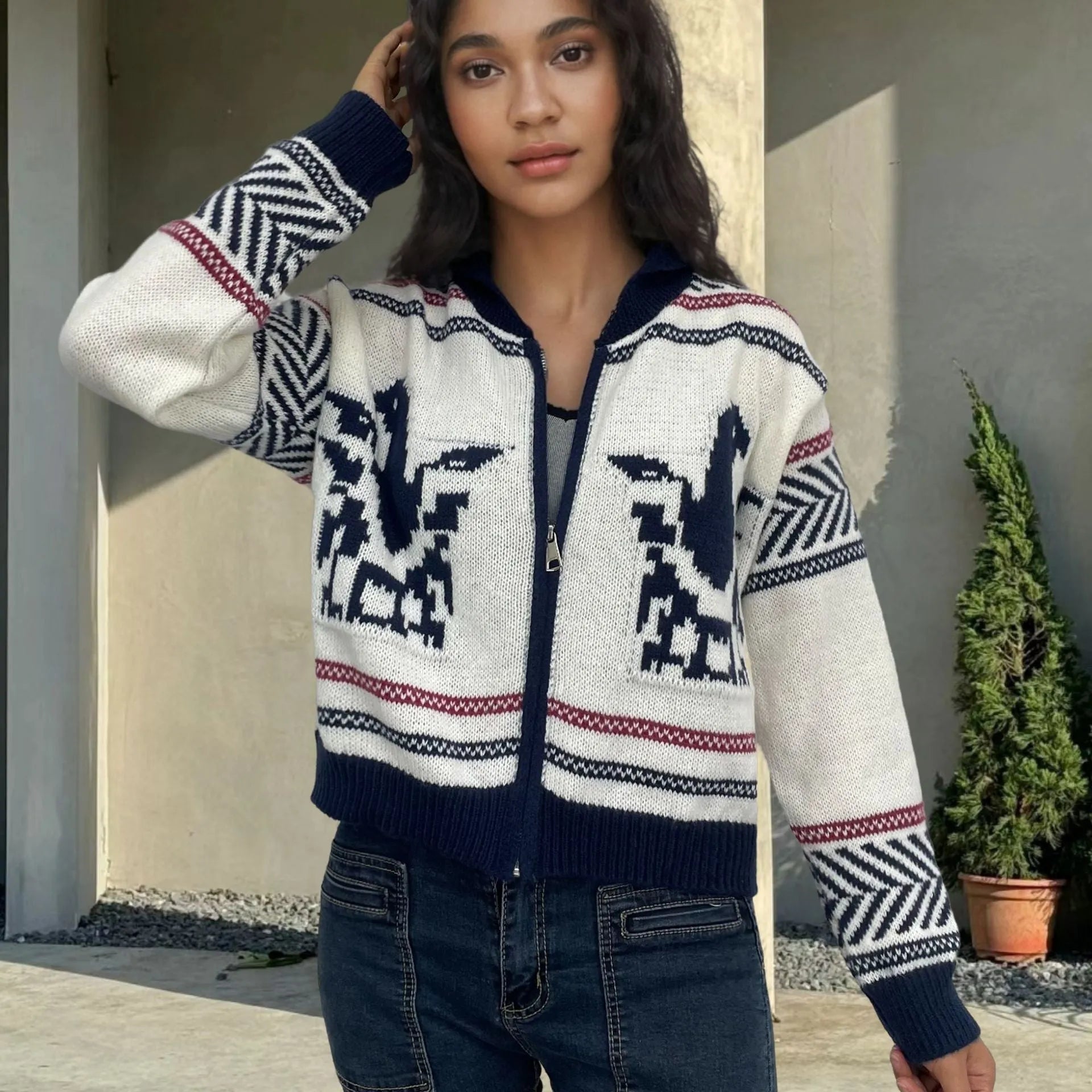 White women's cardigan with contrast stripe pattern, lapel collar, and a full-length front zipper.