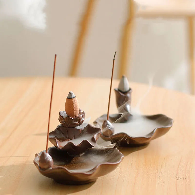 Purple clay ceramic reverse flow incense burner with lotus and plum blossom motifs