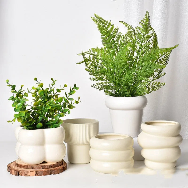Roman column style matte yellow ceramic flowerpot for home plant decoration.