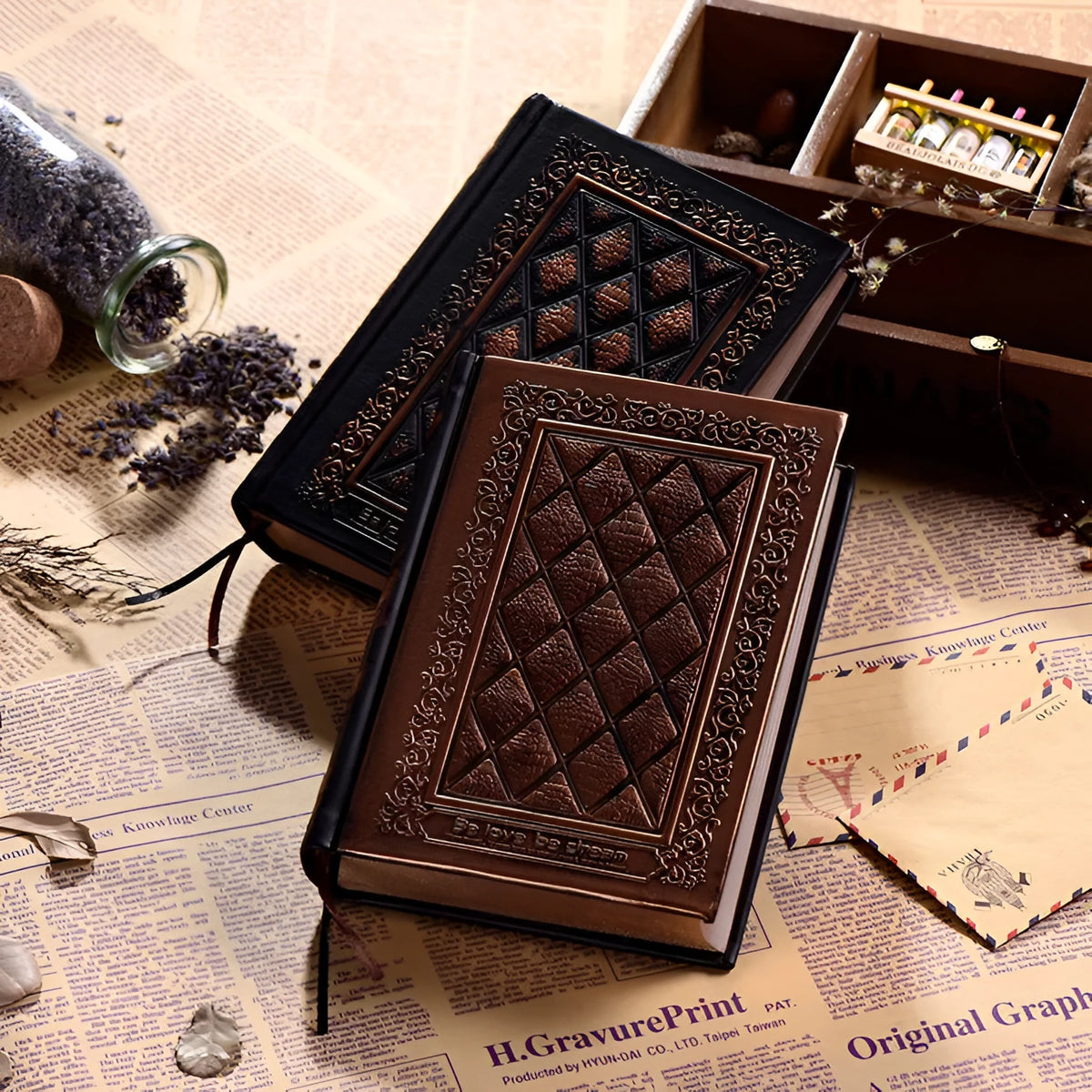 Embossed faux leather notepad showing three-dimensional cover design in bronze and black gold colour options
