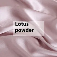 Double-sided solid colour silk duvet cover shown in Lotus Pink on a bed
