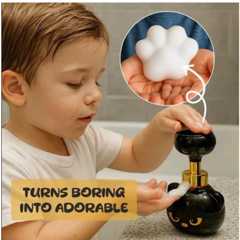 Black plastic cartoon cat shaped foam soap dispenser measuring 10 by 18 centimetres