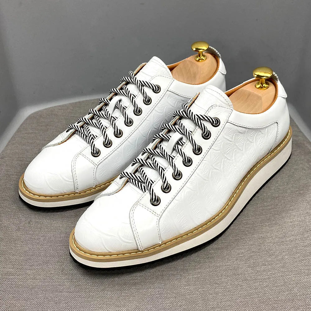 Men's white low-top sneakers with an embossed pattern and front lace-up closure.