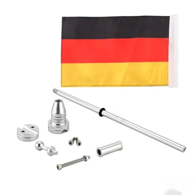 Black and silver motorcycle side box flagpole for mounting on luggage rack or bumper.
