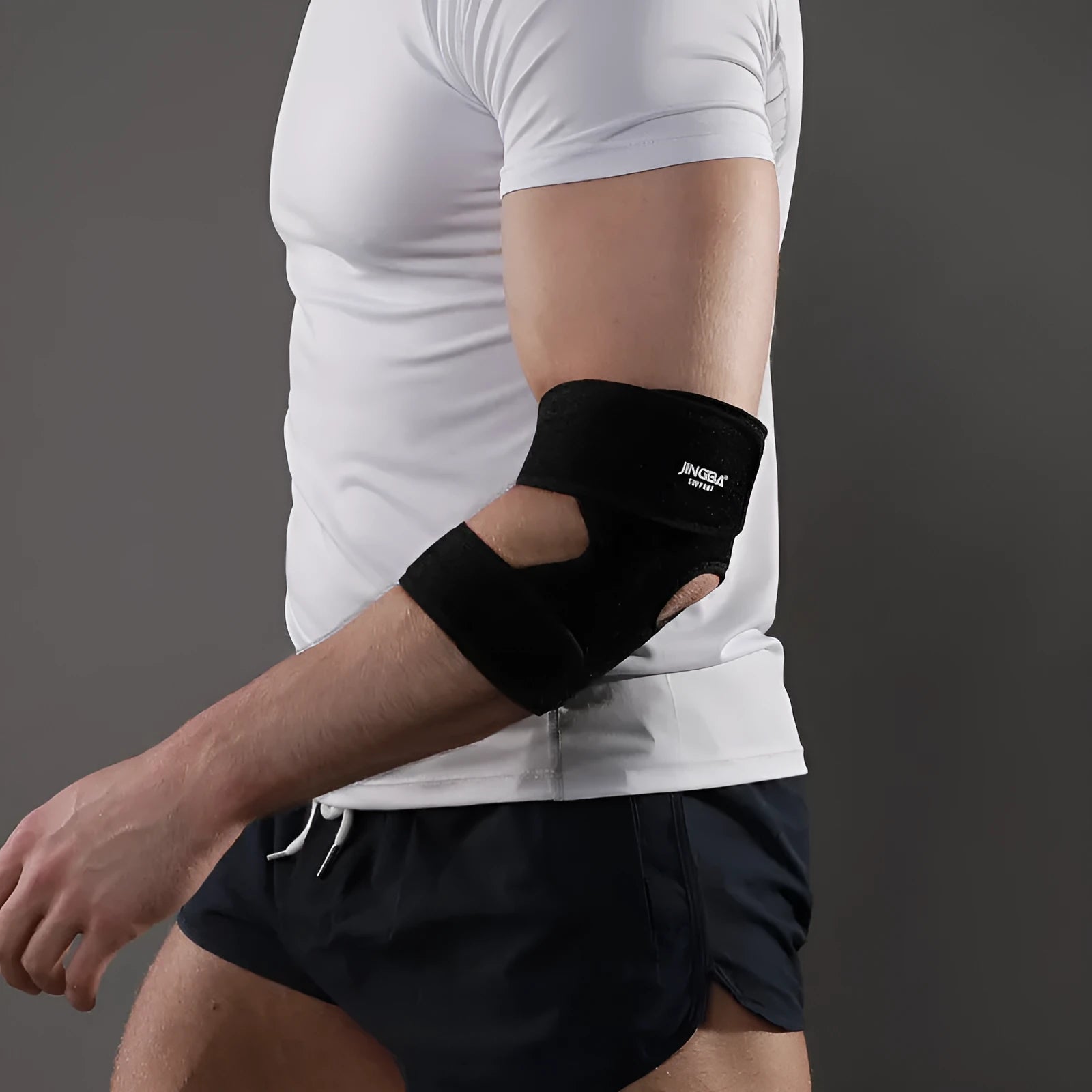 Black adjustable sports elbow guard for badminton, basketball, tennis, and multi-sport protection