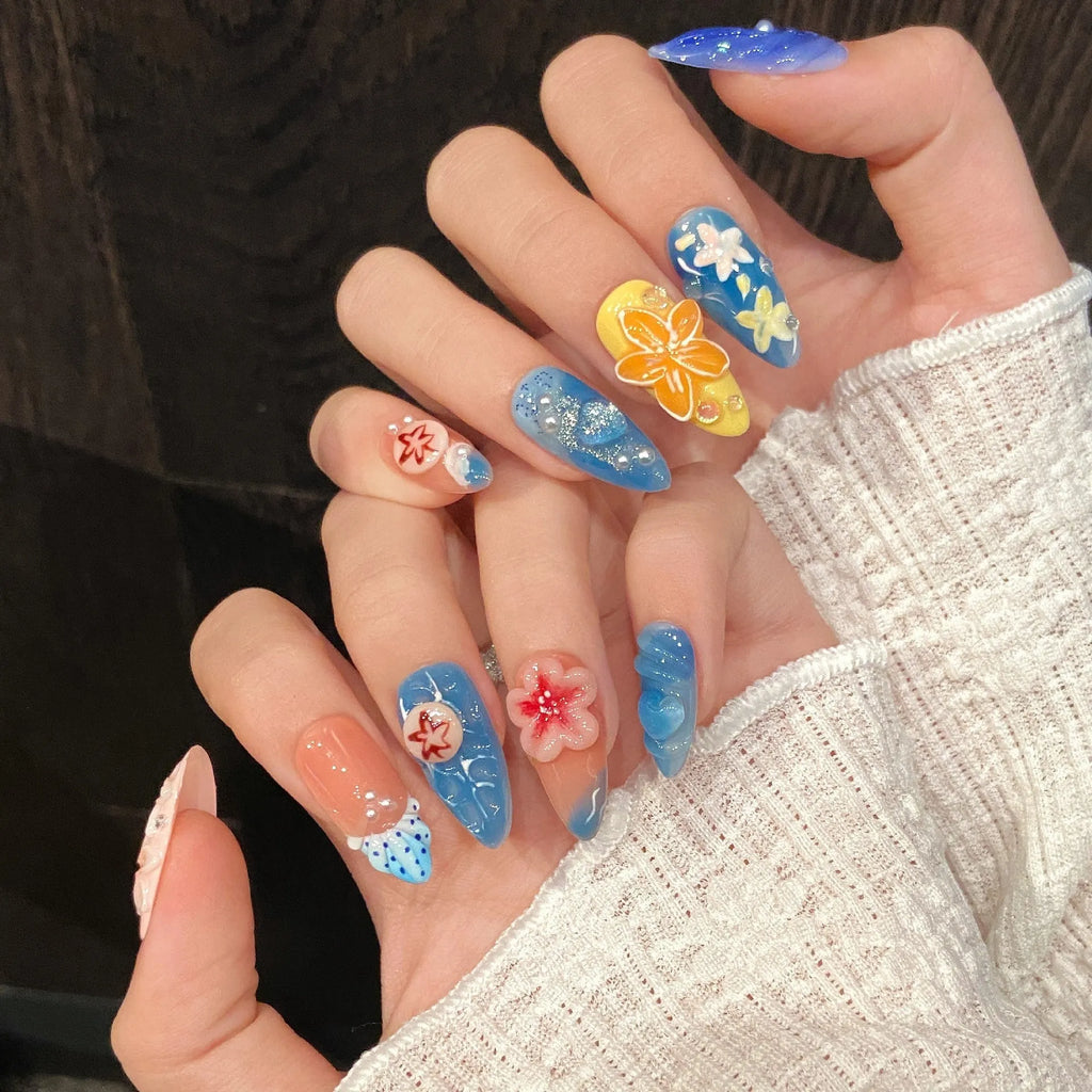Three-dimensional carved jellyfish plastic armour set in almond nail colour, showing rose and tulip patterns.