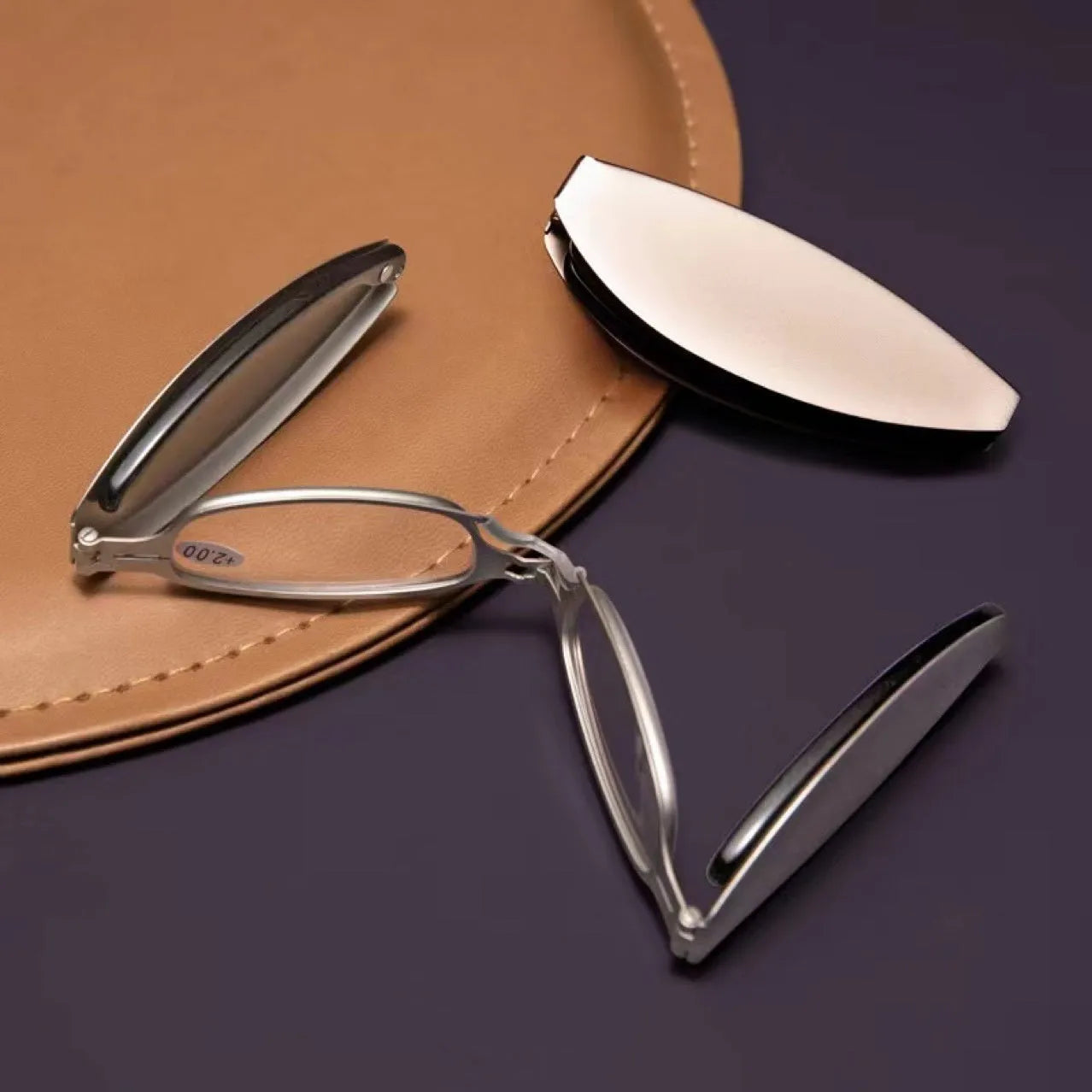 Folding pocket presbyopic glasses with retro frame, shown in black and silver colours