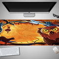 Oversized Halloween-themed rubber cloth mouse pad with non-slip base on a desk.