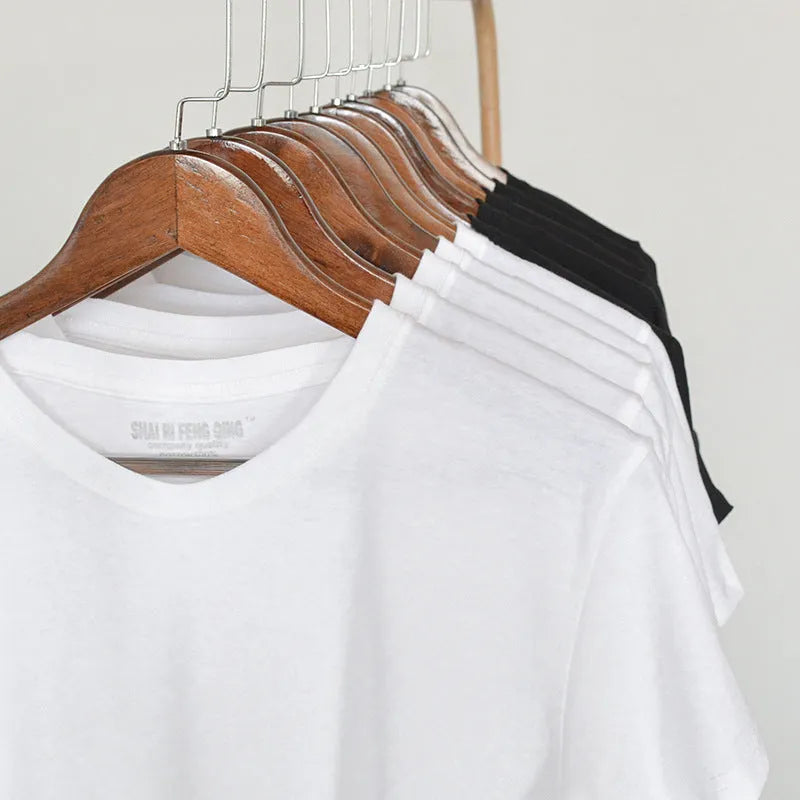 Men's solid colour cotton round neck T-shirt on hanger showing short sleeve casual design