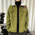 Man wearing a khaki coloured loose fit corduroy work jacket with stick pockets.