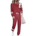 Women's plus size loose-fitting casual suit set in a solid colour, showing the long-sleeve top and matching trousers.