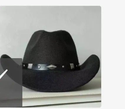 Brown leather velvet curved-edge western cowboy hat with a conical crown on a plain background.