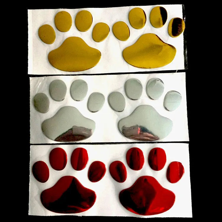 PVC dog footprint car sticker in black, gold, red, and silver colour options, measuring 7cm.