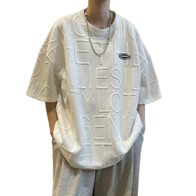 Grey men's loose fit t-shirt with a retro-style three-dimensional raised letter print on the front.