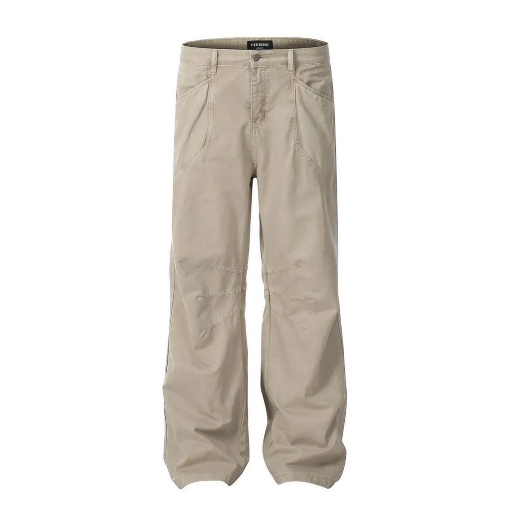 Men's brown loose fit straight leg cotton jeans with a high waist and zip fly on a hanger.