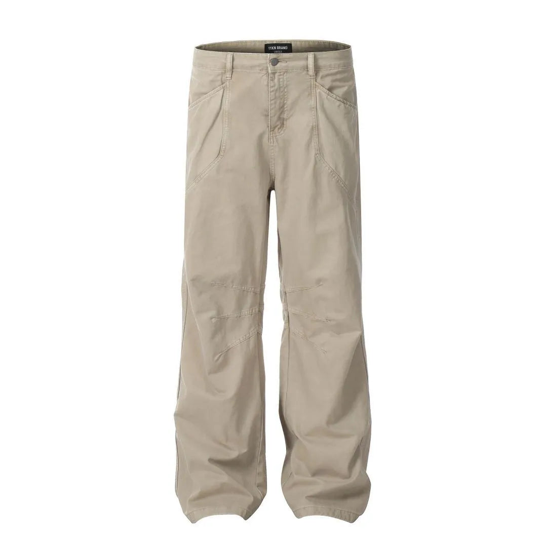 Men's brown loose fit straight leg cotton jeans with a high waist and zip fly on a hanger.