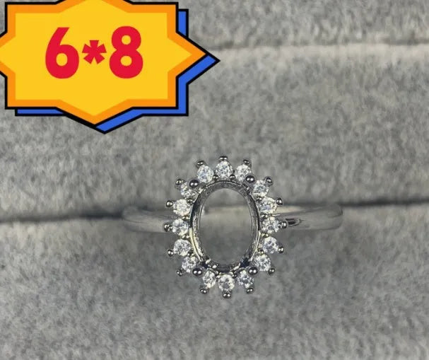 Oval denier ring with 6x8mm stone, open mouth design, and five-pointed star detail