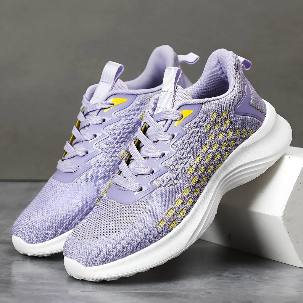 Women's lavender purple Flyknit running shoes with mesh lining and striped pattern for athletic use