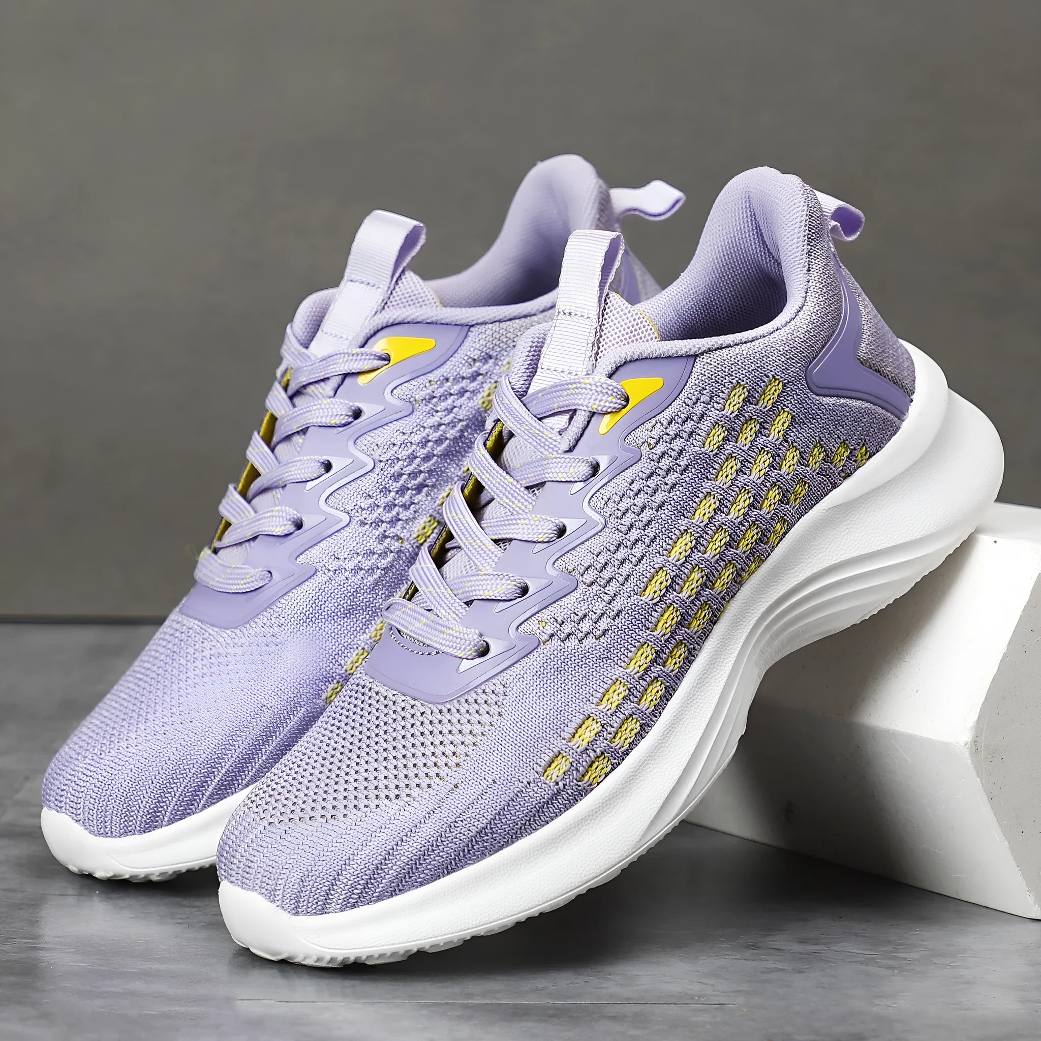 Women's lavender purple Flyknit running shoes with mesh lining and striped pattern for athletic use