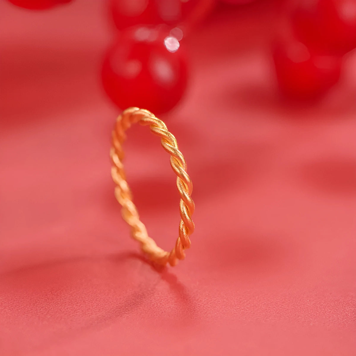 Brass gold plated women's ring showing simple bracelet and twist style options on a finger