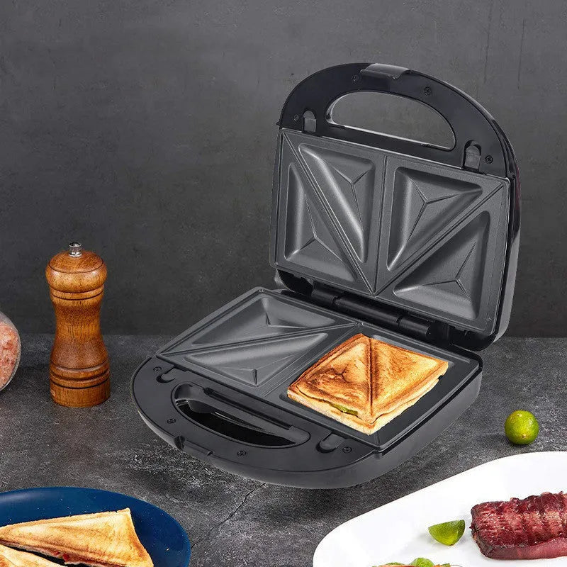 Black double-sided electric sandwich pan with six interchangeable non-stick plates and brushed stainless steel cover