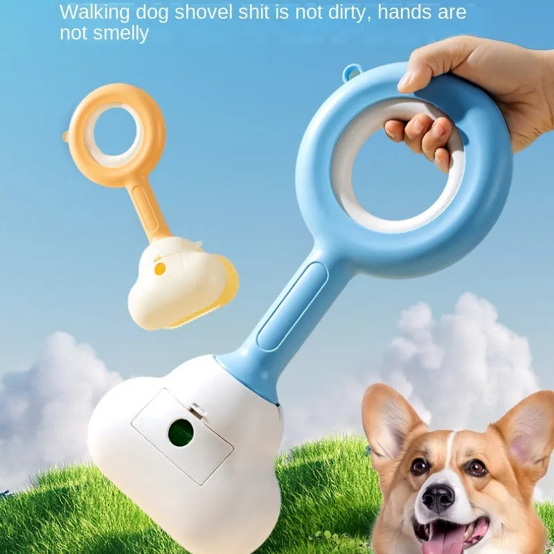 Blue and white dog pooper scooper with cloud-shaped jaw on a garden lawn.