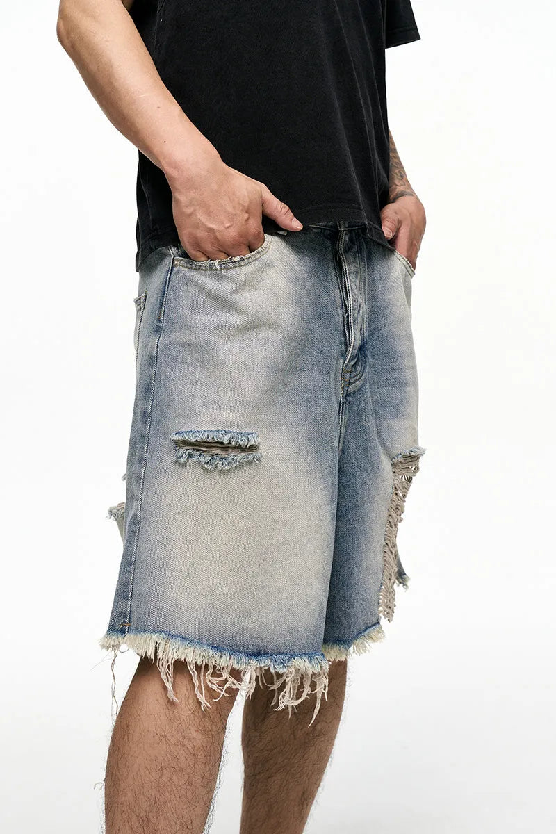 Light blue retro washed denim shorts with wide leg baggy cut and fifth pants length