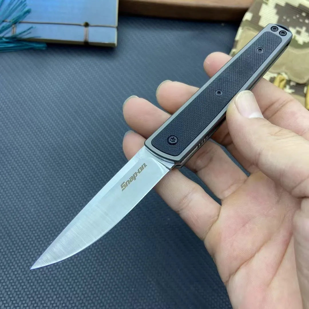 Folding fruit knife with stainless steel blade shown unfolded displaying 7cm blade length and 10cm handle