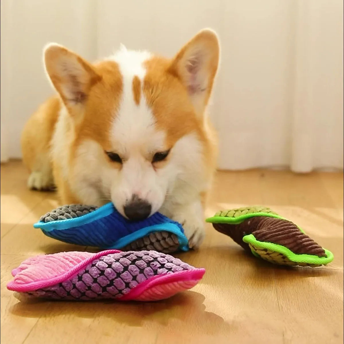 Blue plush teddy dog toy with a bone shape, designed for small to medium breeds with squeaker and crackling paper inside.
