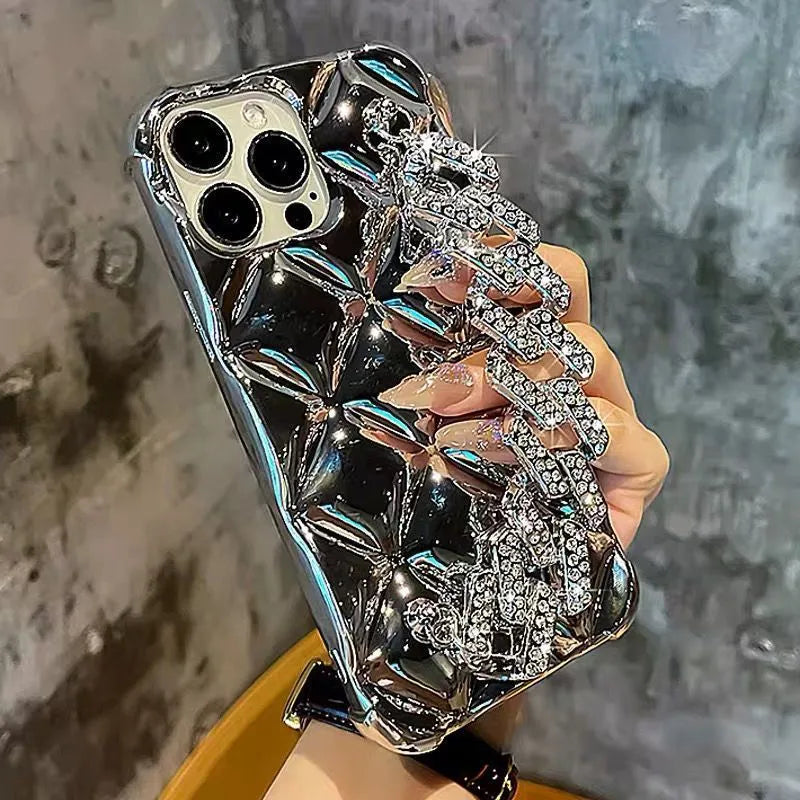 Gold and silver luxury iPhone cases with attached chain and diamond lock bracelet.