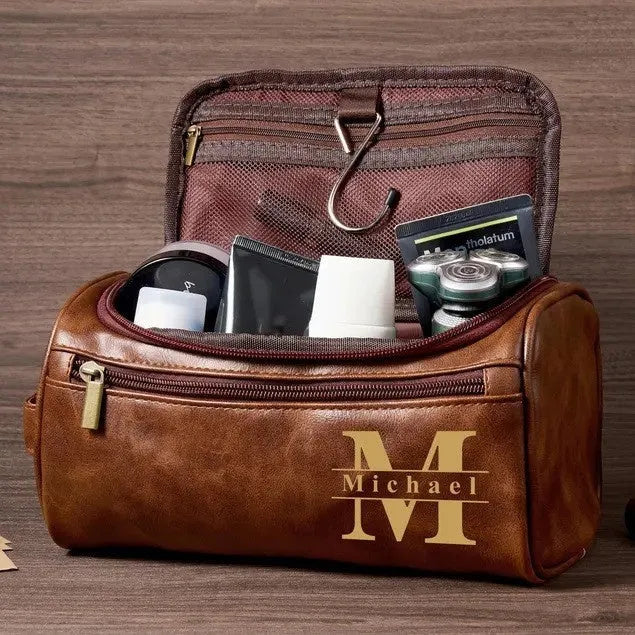 Men's black PU leather travel bag with seven compartments open, showing internal organisation