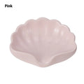 White shell-shaped plastic soap dish for bathroom counter