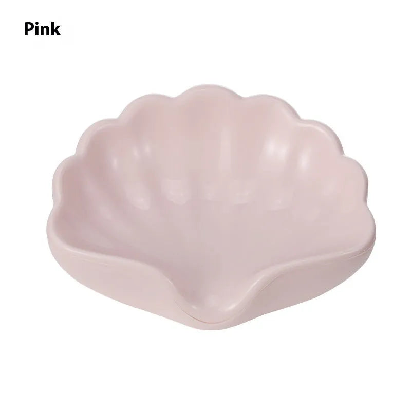 White shell-shaped plastic soap dish for bathroom counter
